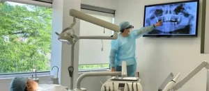 Dr. Aristo Carranza discussing a minimally invasive wisdom teeth removal plan with a patient at Smile Design NJ