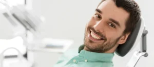 Adult patient discussing permanent dental implants in NJ at Smile Design NJ clinic.